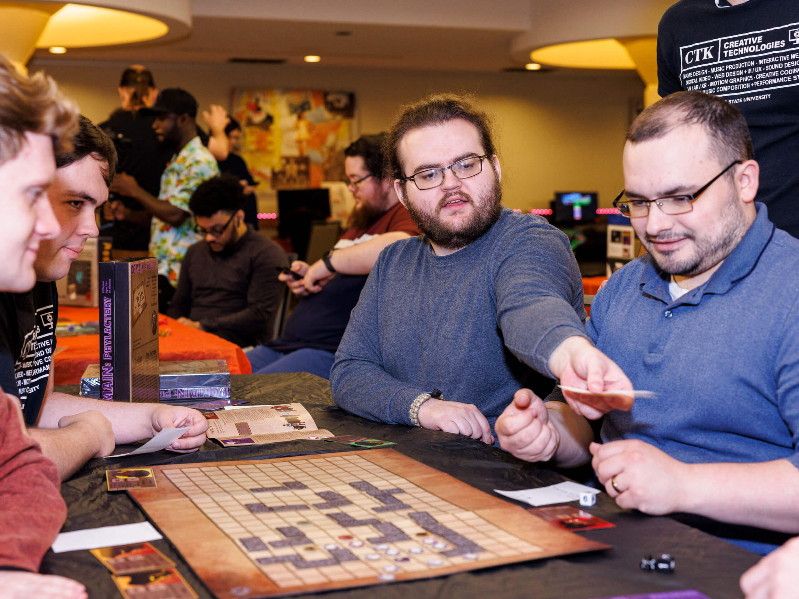 Students play board games at the CTK Games Showcase.