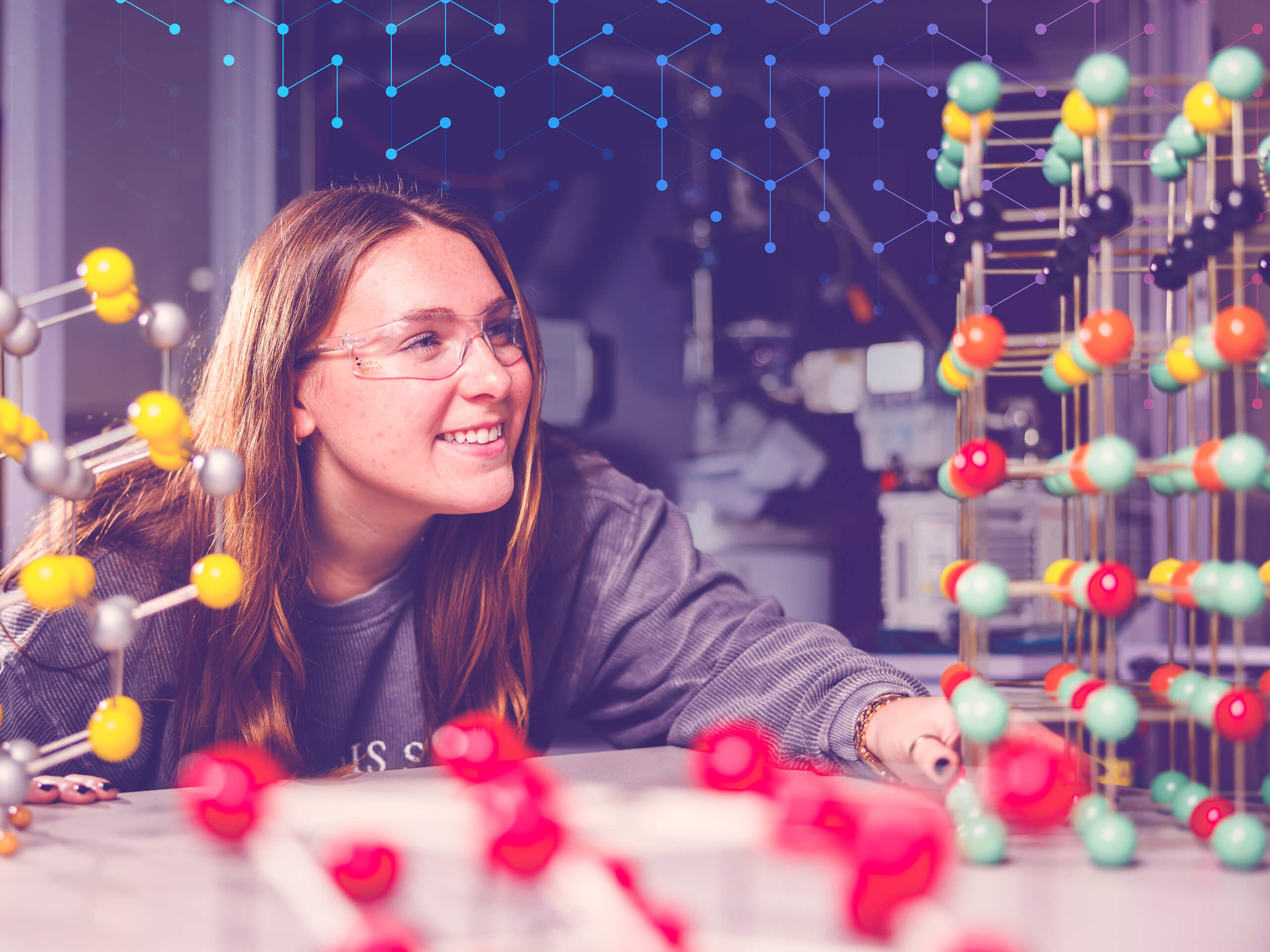 Student looks at scientific equipment